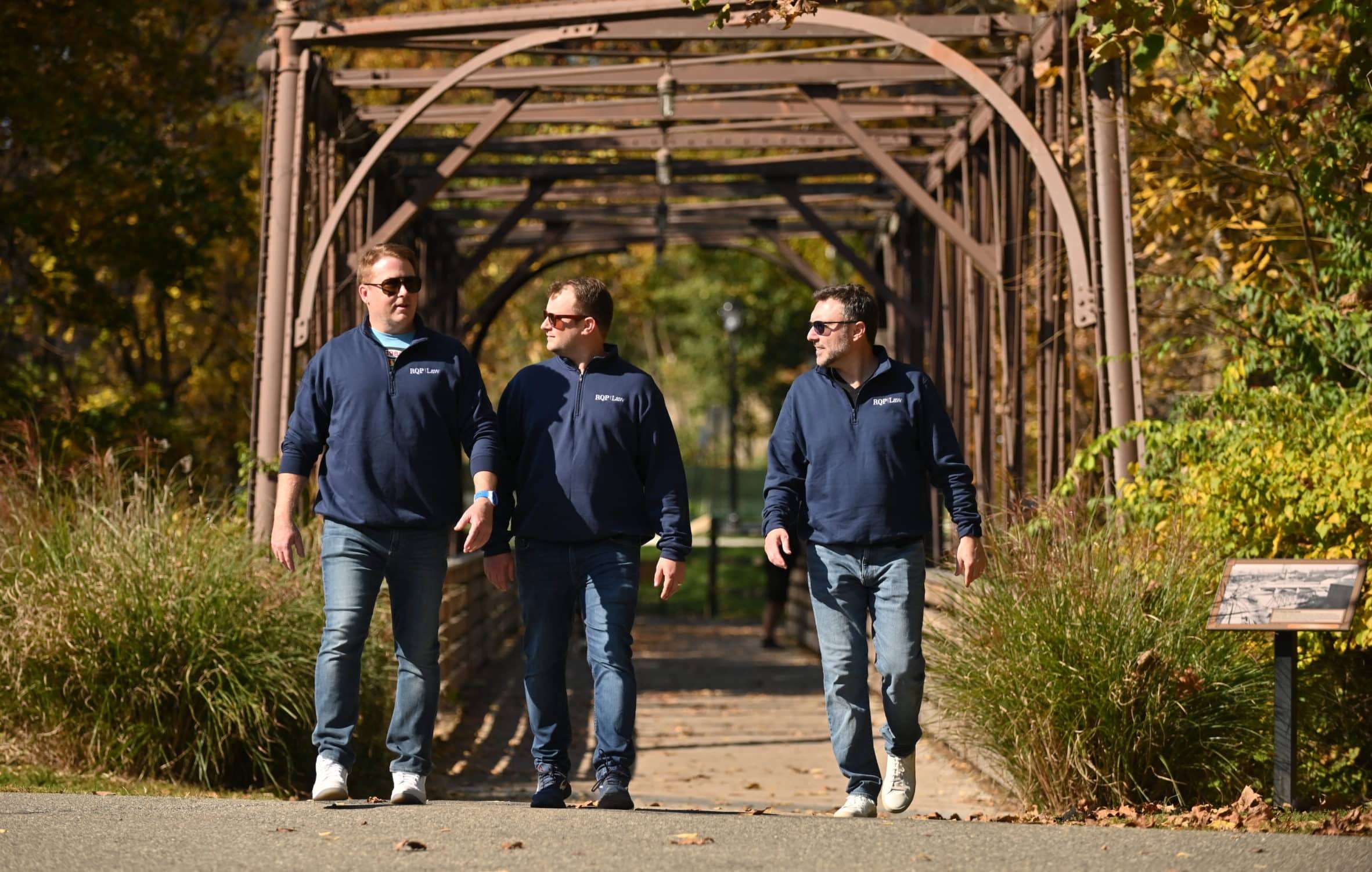 DSC_7403 RQP Law attorneys walking outside in discussion